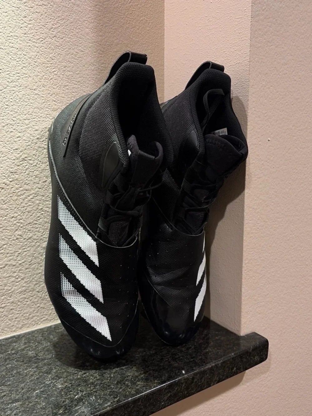 Black Mens Size 11 Football Cleats with White Stripes